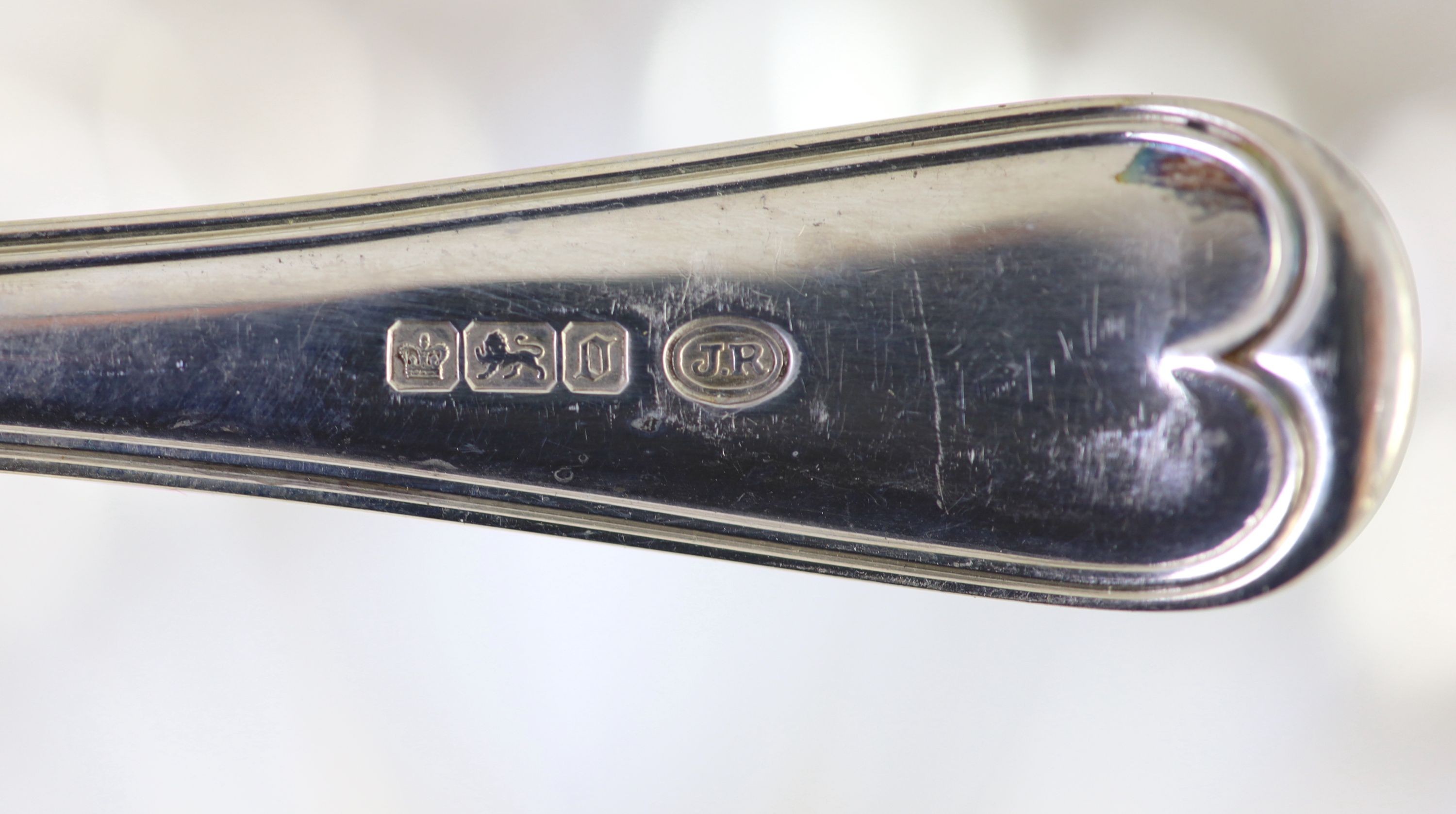 A part canteen of Edwardian silver Old English double struck thread pattern flatware for twelve by John Round & Son Ltd